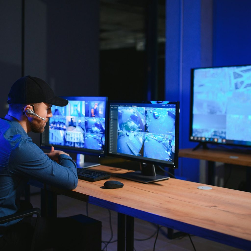 Male security guard in surveillance room